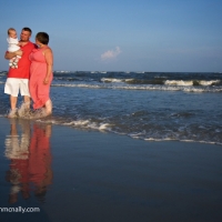 family of three on beach tybee